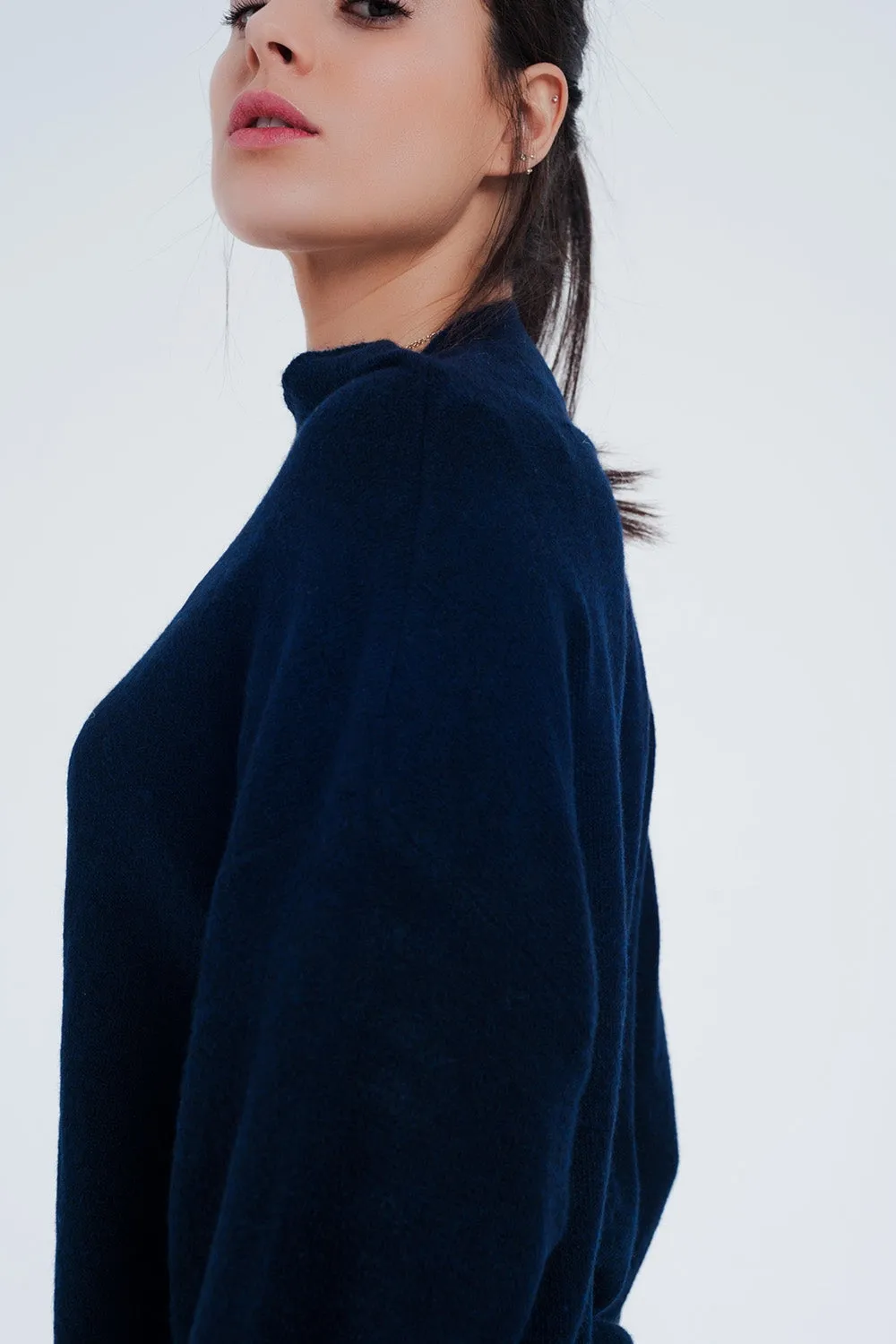 Navy blue sweater with wide sleeves