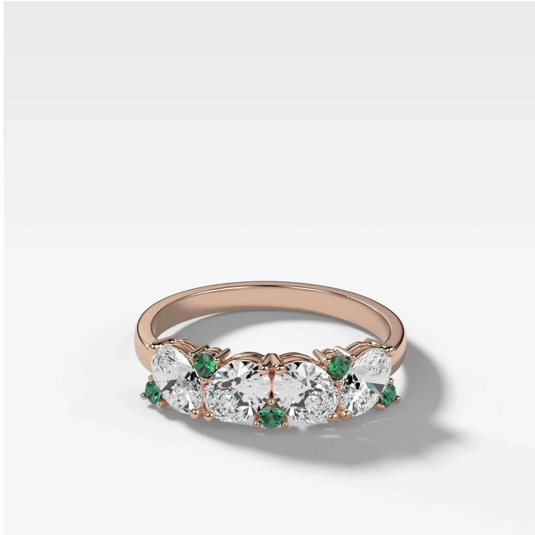 Oval Diamond And Green Emerald Medley Halfway Wedding Band