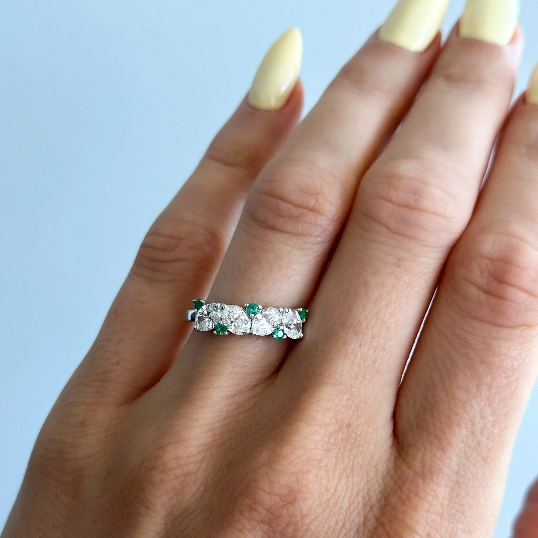 Oval Diamond And Green Emerald Medley Halfway Wedding Band